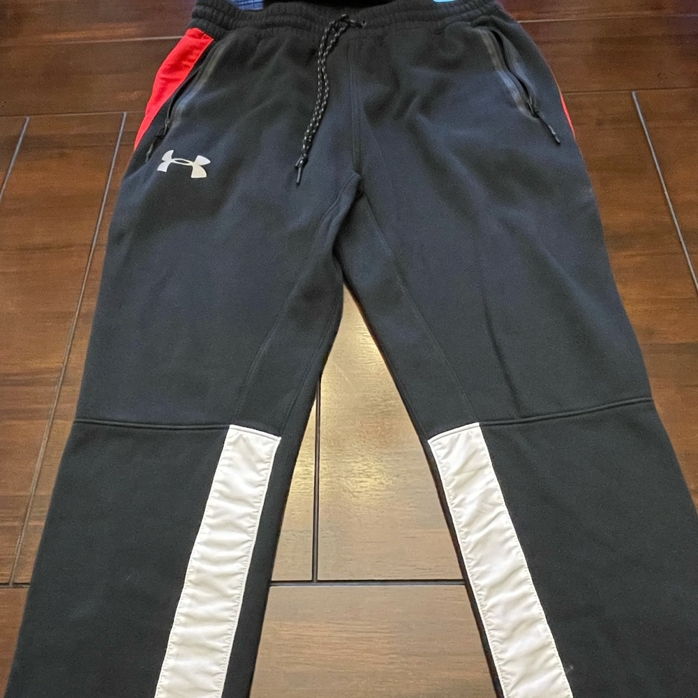 Under Armour track pants.  XL
